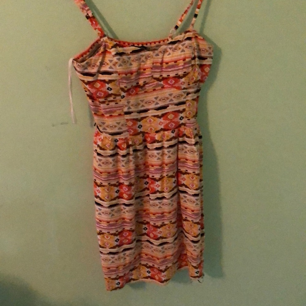 Yellow patterned mini dress.